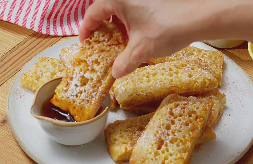 Air fryer Buttered Crumpet Squares with Icing Sugar and Maple Syrup