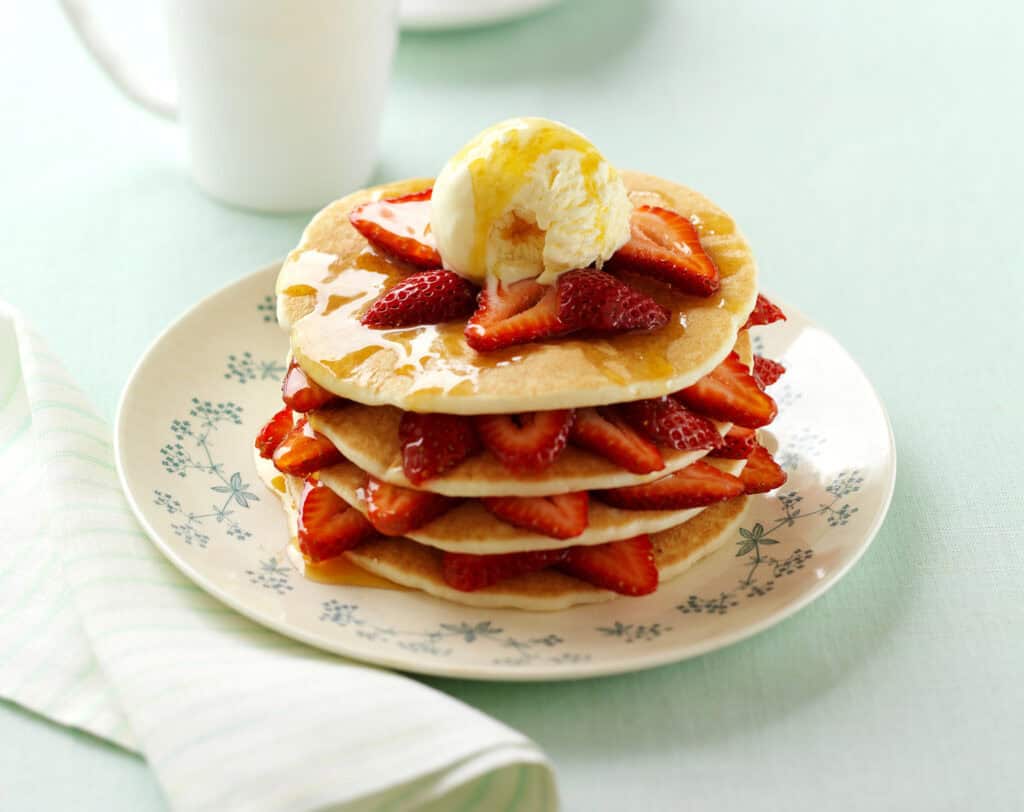 Golden Pancakes with Strawberries and Ice Cream