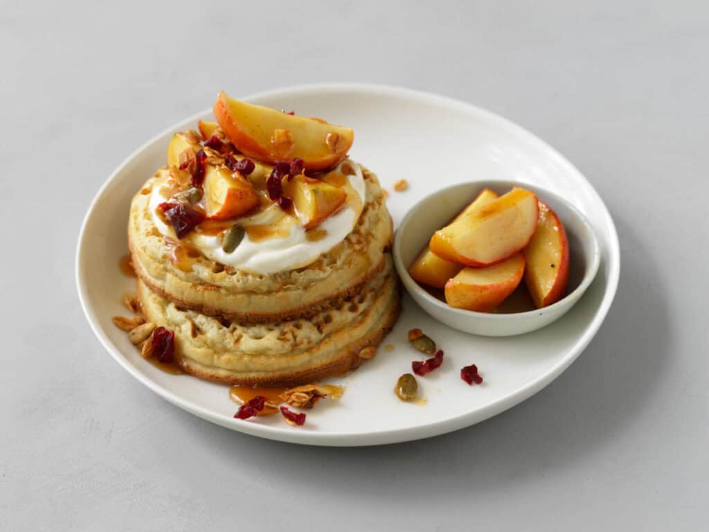 Peaches, Cream, and Crushed Nuts on Crumpet Rounds